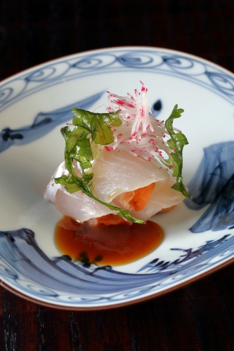 Oita Flounder Sashimi dish with garnish and sauce 